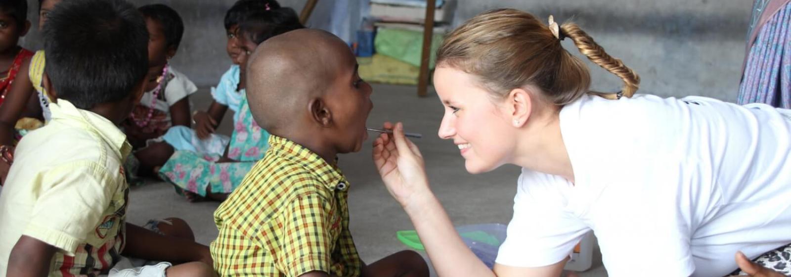 DHWB dentist helping a patient